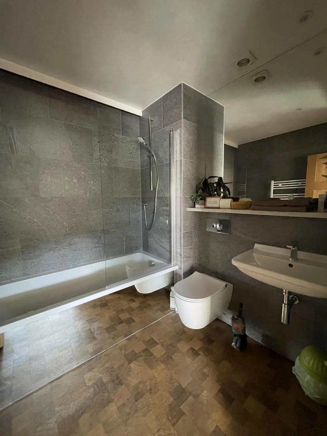 The en-suite bathroom with bath and shower