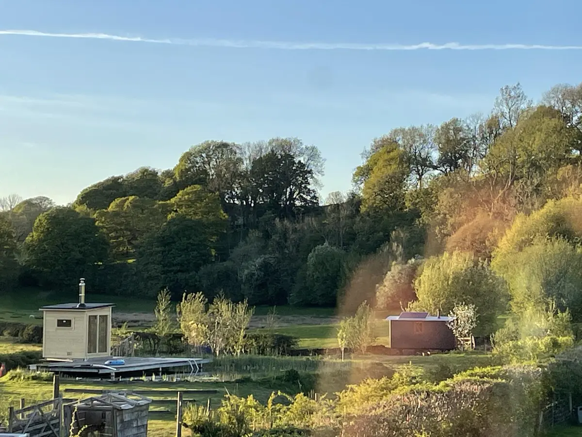 Evening light over the sauna and Dolly the Hut